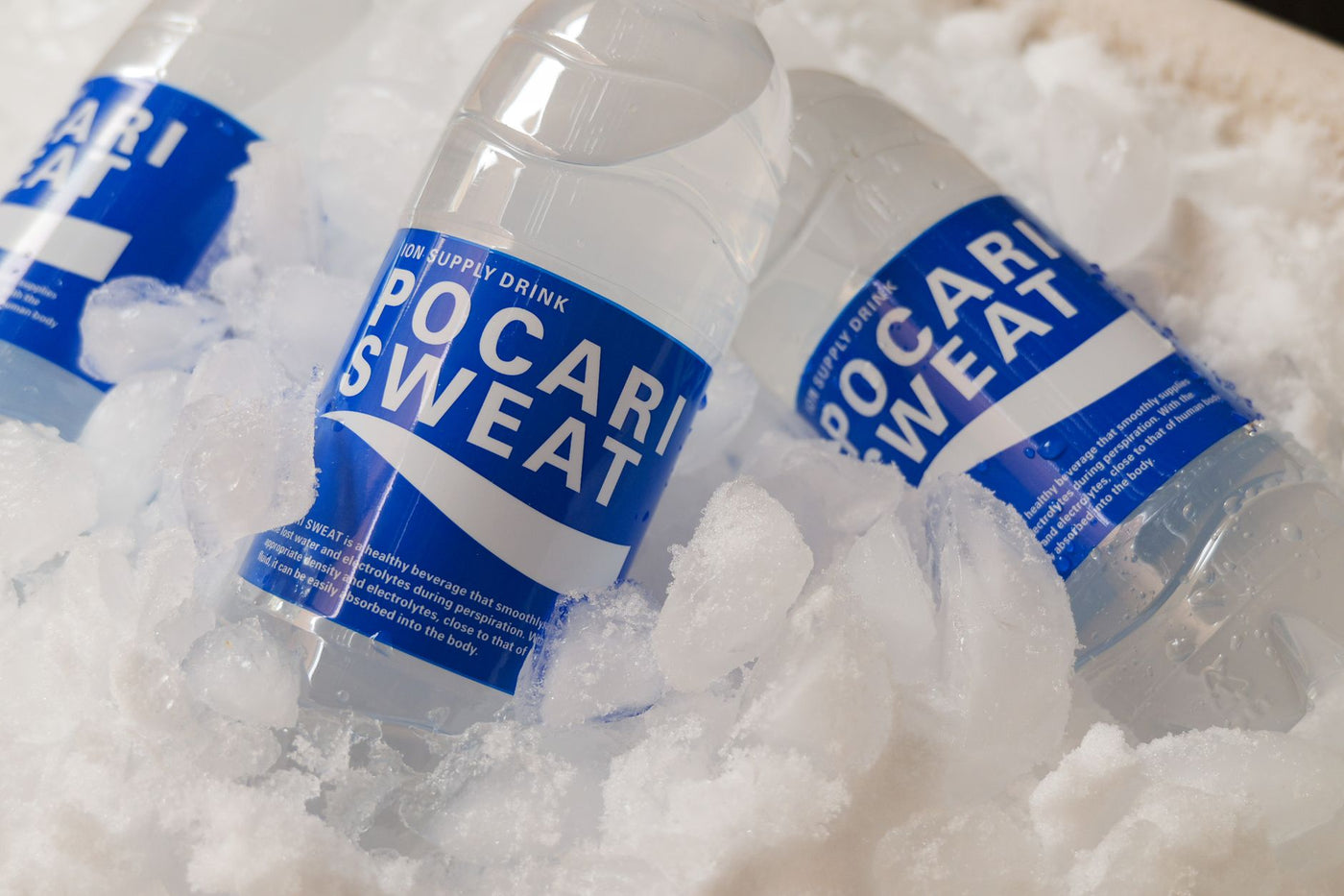 Chilled Pocari Sweat bottles resting in ice, showcasing hydration and refreshment.
